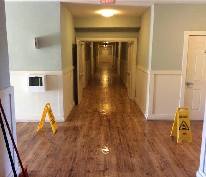 flooded wood floor hallway